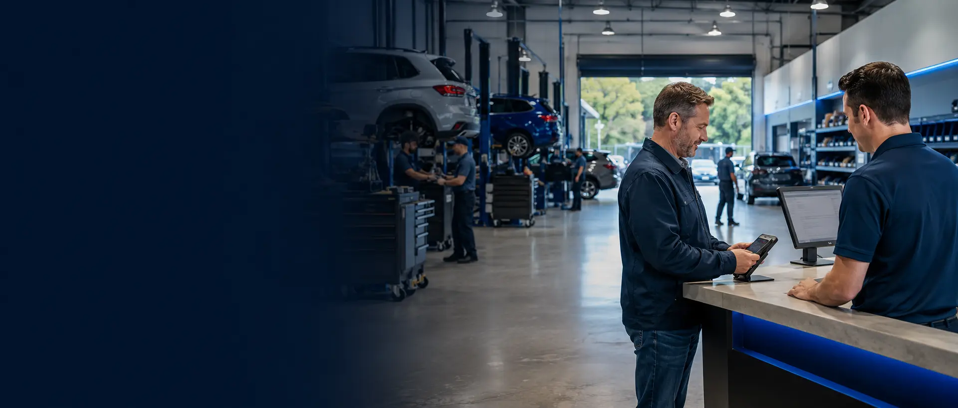 Customer making a payment at a busy automotive repair and dealership service center
